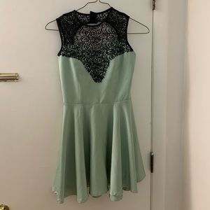 Green designer mini dress with skater skirt